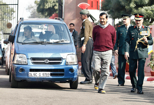 Arvind Kejriwal, head of AAP and Chief Minister of Delhi, walks past his car as he arrives at the NCC camp in New Delhi Reuters Image