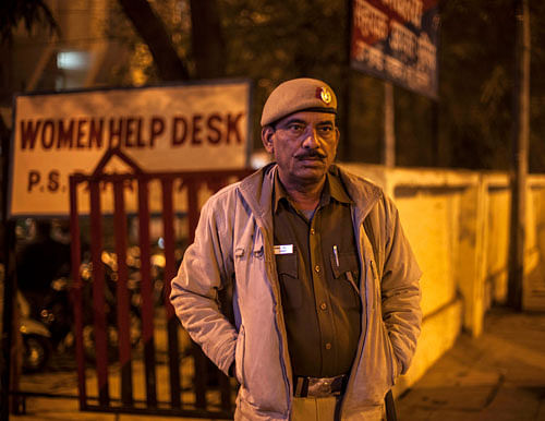 A policeman stands outside the police station which is investigating the gang-rape of a Danish tourist in New Delhi, India, Wednesday, Jan. 15, 2014. A 51-year-old Danish tourist was gang-raped near a popular shopping area in New Delhi after she stopped to ask for directions, police said Wednesday, the latest case to focus attention on the scourge of violence against women in India. The woman managed to reach her hotel in Paharganj area Tuesday evening and the owner called police. AP