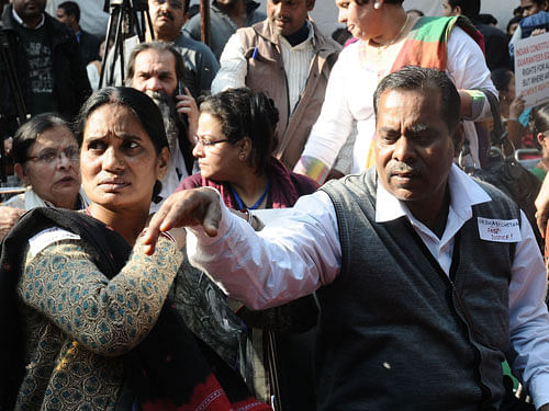 Asha Devi and Badrinath Singh, parents of Jyoti Singh. pti file photo
