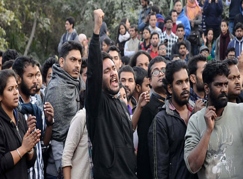 JNU students protesting against alleged police action inside the JNU campus in New Delhi on Saturday. PTI photo