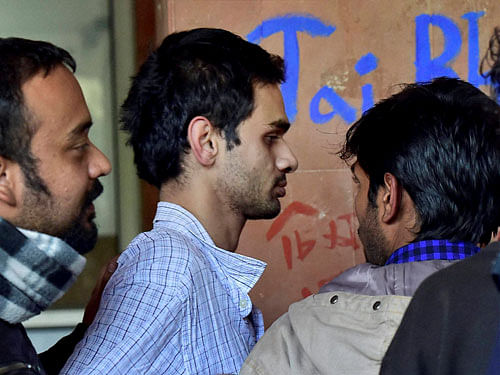 Student activist Umar Khalid (C) on the campus of Jawaharlal Nehru University (JNU) in New Delhi on Monday. Khalid, one of the five students accused of sedition, returned to the University campus on Sunday. PTI file Photo