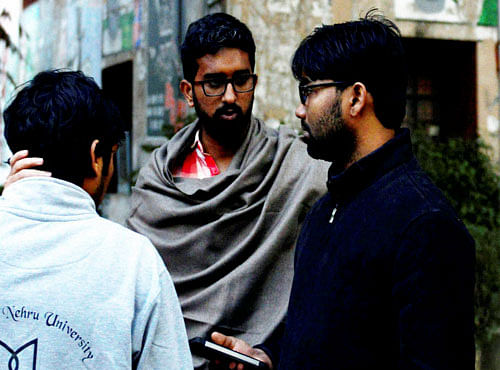 JNU student Ashutosh Kumar (R) who are facing charges of sedition at JNU campus in New Delhi. PTI Photo