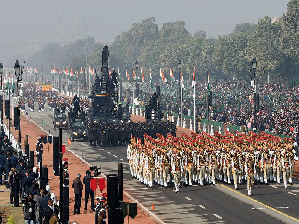Contingents marching past during a full dress rehearsal for the Republic Day Parade at Rajpath in New Delhi on Monday. PTI Photo
