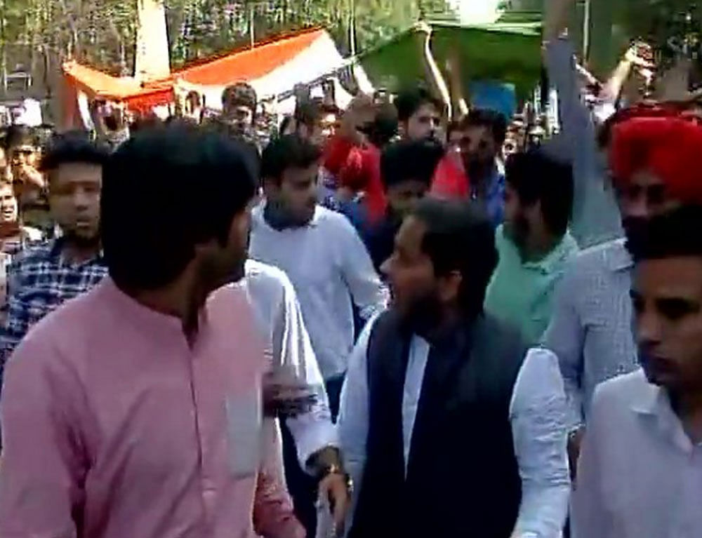 Raising slogans of 'Vande Mataram' and calling it a 'march for the nation', the ABVP members carried the national flag as they marched inside the Ramjas College campus.