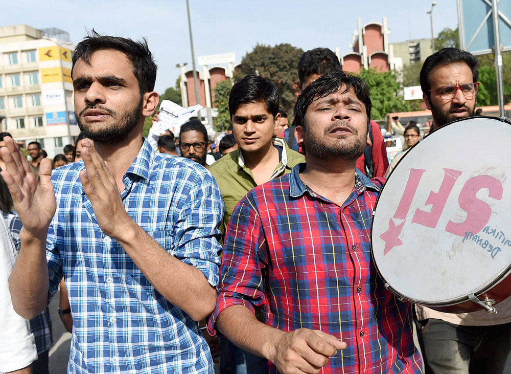 JNU students Kanhaiya Kumar and Umar Khalid with others during a protest outside the UGC building in New Delhi on Friday. PTI Photo