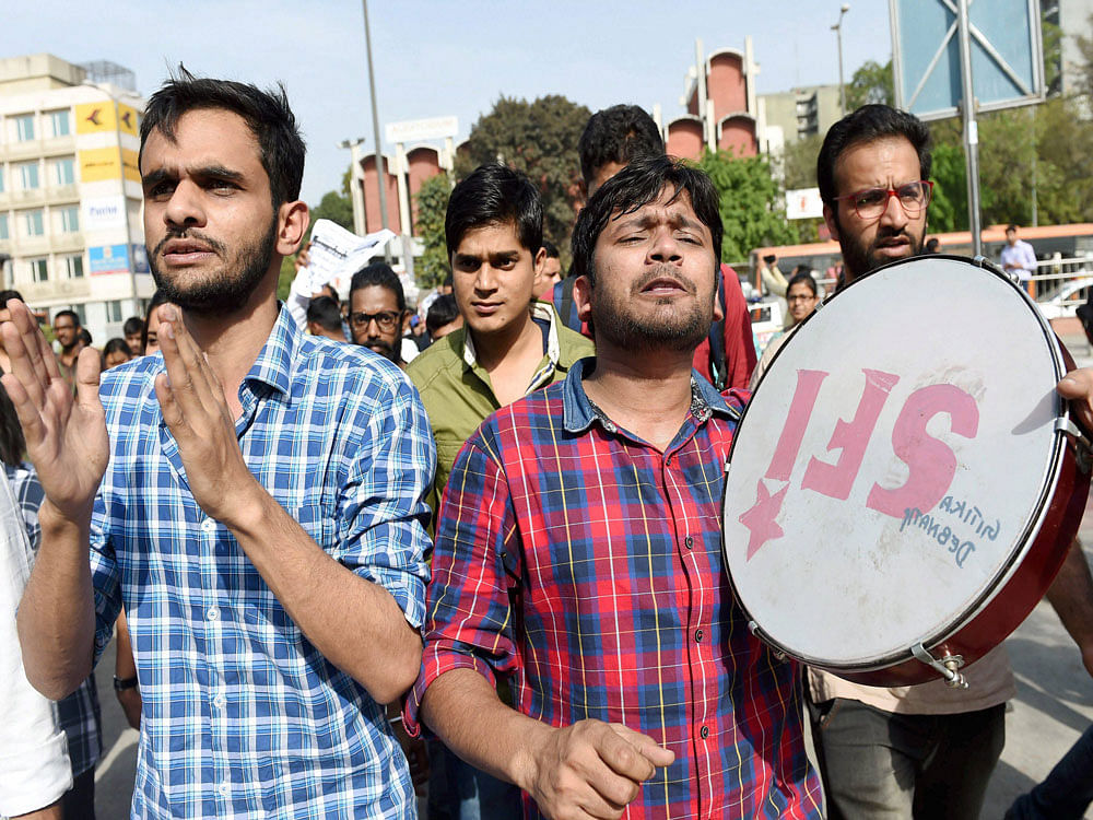 JNU students Kanhaiya Kumar and Umar Khalid with others during a protest outside the UGC building in New Delhi. PTI Photo