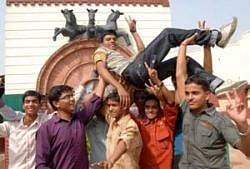 soaring high: IIT-JEE qualifier Abhishek Kumar Bhartis friends lift him up to celebrate his result.