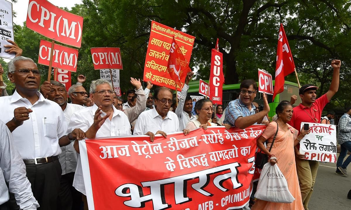 CPM leader Sitaram Yechury, CPI leader D Raja along with other leaders shout anti-government slogans during the 'Bharat Bandh', in New Delhi on Monday. (PTI)