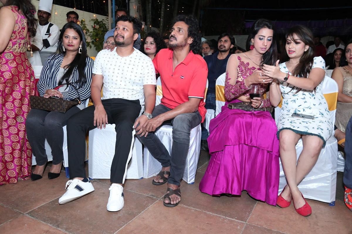 Ganesh (in white) and Sanjjanaa Galrani (in bright pink) were among some of the guests at the event.