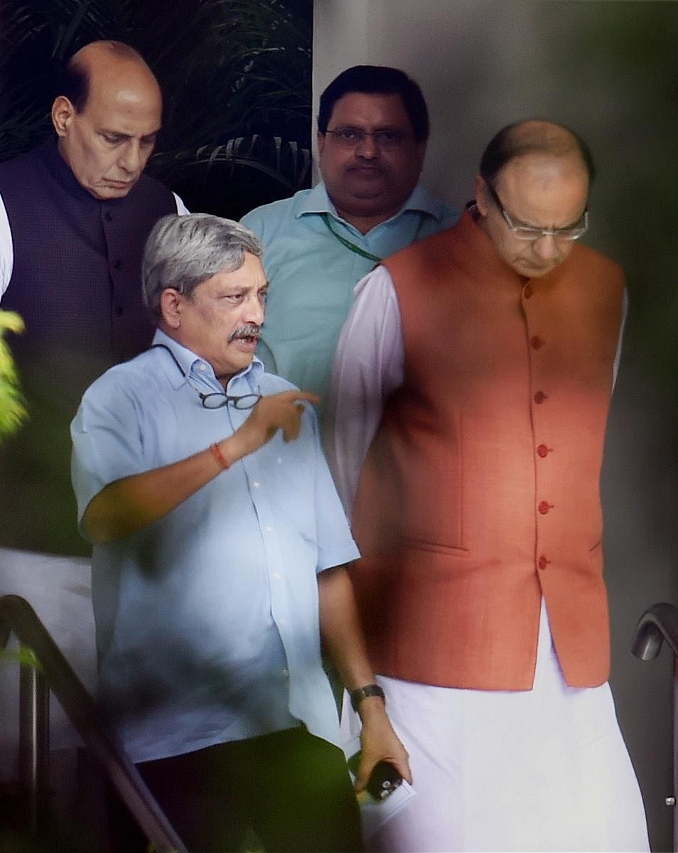 In this file photo taken on July 22, 2016, Defence Minister Manohar Parrikar is seen with Union ministers Rajnath Singh and Arun Jaitley, in New Delhi. PTI