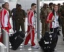 Members of the England team walk past security personnel as they arrive at the Indira Gandhi International Airport ahead of the Commonwealth Games in New Delhi, India, Tuesday, Sept. 28, 2010. The multi-sport games, held every four years, bring together nearly 7,000 athletes and officials from 71 countries and territories from across the former British empire. AP
