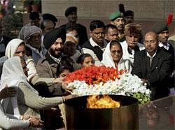 All India Anti Terrorist Front Chairman M S Bitta along with family members of 2001 Parliament attack victims paying homage at Amar Jawan Jyoti on the occasion of 10th anniversary of the attack, at the India Gate in New Delhi.PTI Photo