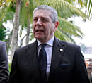 Italian Defense Minister Giampaolo di Paola (C) speaks at a news conference as Italian sailors Salvatore Girone (R) and Massimiliano Latorre stand beside him at a hotel lawn in the southern Indian city of Kochi December 16, 2012. Italy expressed 'strong disappointment' on Friday that India's Supreme Court had delayed a decision on where two Italian marines accused of killing two fishermen would face trial. The sailors, members of a military security team protecting the cargo ship Enrica Lexie from pirate attacks, fired on a fishing boat they mistook for a pirate craft off Kerala in February, killing two. REUTERS photo