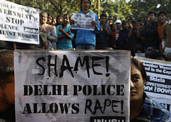 An Indian woman along with the others participates in a protest condemning the gang rape of a 23-year-old student on a city bus late Sunday in New Delhi, India, Tuesday, Dec. 18, 2012. The Indian parliament Tuesday witnessed outrage over the issue even as the victim is battling for her life at a city hospital. AP