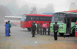 The thick blanket of fog over the City bus stand in Kolar. DH photo
