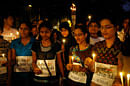 Indian people offer prayers as they hold candles during a candle light vigil in Mumbai, India, Thursday, Dec. 20, 2012. The hours-long gang-rape and near-fatal beating of a 23-year-old student on a bus in New Delhi triggered outrage and anger across the country as Indians demanded action from authorities who have long ignored persistent violence and harassment against women.AP Photo