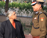 Delhi Chief Minister Sheila Dikshit and Police Commissioner Neeraj Kumar during cremation of constable Subhash Chand Tomar in New Delhi on Tuesday. Tomar died at a hospital on Tuesday after sustaining injuries during Sunday's massive protest against gangrape case. PTI Photo