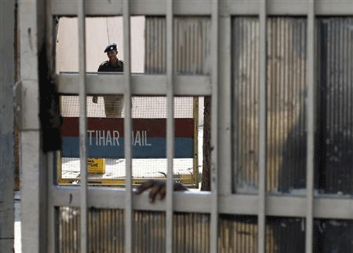 File image: A policeman walks inside the Tihar Jail in New Delhi March 11, 2013. Reuters