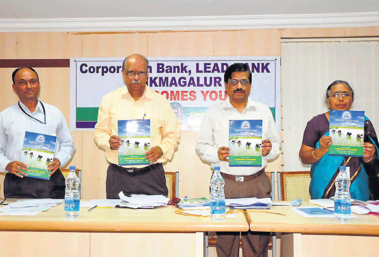 Zilla Panchayat CEO P Shivashankar releases district annual credit plan for 2013-14, in Chikmagalur on Tuesday. Lead Bank Manager N T Narayanamurthy, Reserve Bank Deputy General Manager Parvathi Sharma and Corporation Bank Udupi region Deputy General Manager N Manjunath Shenoy look on.