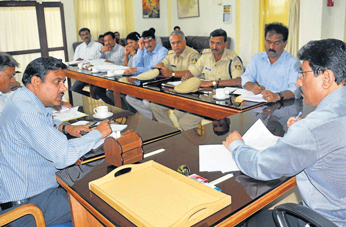 new plans: Deputy Commissioner Ramegowda and Mysore Airport Director C Manjunath at a meeting held at DC's office, in Mysore, on Monday. DH Photo