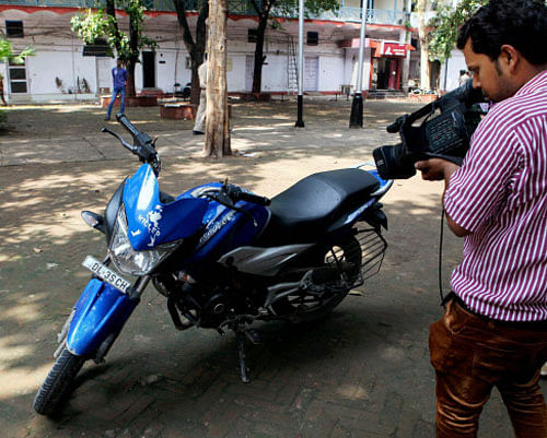 Motorcycle of youngster, who was shot dead by a police firing at Windsor place in New Delhi on Sunday. PTI Photo