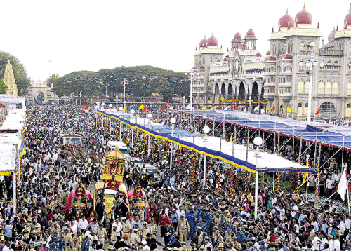 Festive fervour: A sea of humanity witnesses Jamboo Savari in Mysore on Monday. Participants in the procession. KPN