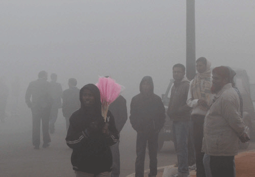 Delhiites enjoying foggy morning in New Delhi on Monday. PTI Photo