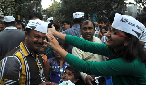 Members of Aam Aadmi Party register new members during a membership drive in Bangalore on Sunday./PHOTO Kishor Kumar Bolar