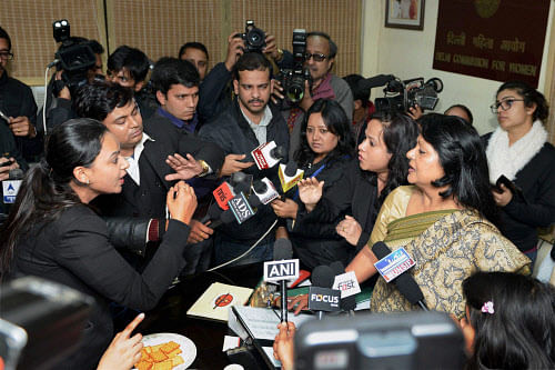 : Delhi Law Minister Somnath Bharti's lawyers and the Delhi Commission for Women Chairperson Barkha Singh confront in New Delhi on Friday. The Law Minister had been summoned by the women's commission to explain charges that he had mistreated African women during his controversial raid last week, but he sent his lawyer. PTI Photo