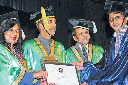 proud moment: Biocon MD Dr Kiran Mazumdar-Shaw and Union Minister for Health Ghulam Nabi Azad present the Golden Jubilee award for Best Outgoing Student in DM Neurology-2013 to Dr Gudipati Anant Ram at the 18th convocation of Nimhans in the City on Wednesday. Nimhans Director P Satish Chandra is with them. dh photo