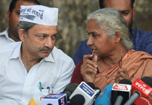 Social activist Medha Patkar with AAP leader Mayank Gandhi during a press conference in Mumbai.  The Aam Aadmi Party (AAP) Sunday announced the first list of 20 candidates for the Lok Sabha polls. Prominent among them are social activist Medha Patkar, Anjali Damania, Yogendra Yadav and Kumar Vishwas. PTI Photo