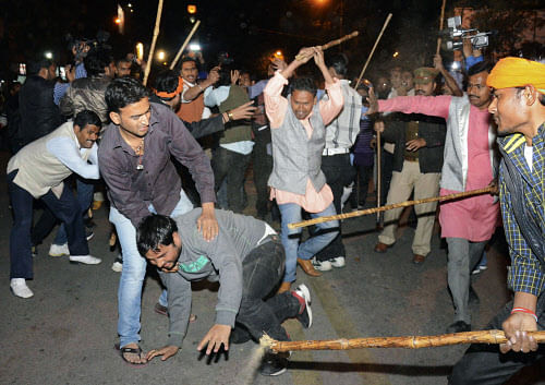 Supporters of AAP and BJP clash during a protest outside the office of BJP in Lucknow. Reuters
