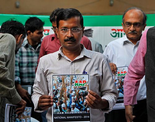 Aam Aadmi Party (AAP),or Common Man Party, chief Arvind Kejriwal releases the party's manifesto ahead of the general elections in New Delhi, India, Thursday, April, 3, 2014. India will hold national elections from April 7 to May 12, kicking off a vote that many observers see as the most important election in more than 30 years in the world's largest democracy. (AP Photo/Tsering Topgyal)