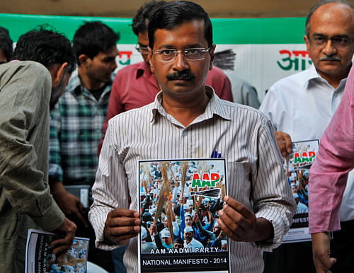 Aam Aadmi Party (AAP), chief Arvind Kejriwal releases the party's manifesto ahead of the general elections in New Delhi, Thursday, April, 3, 2014. AP
