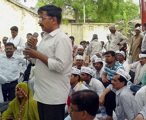Varanasi : AAP convener Arvind Kejriwal speaks during a public meeting in a village as part of his election campaign in Varanasi on Thursday. PTI Photo