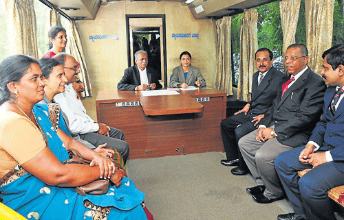 District Principal and Sessions judge K S&#8200;Mudagal, Mysore Bar Association president, H V S Murthy and others at a programme held to flag off the mobile court cum legal aid vehicle, in Mysore, on Monday. DH photo