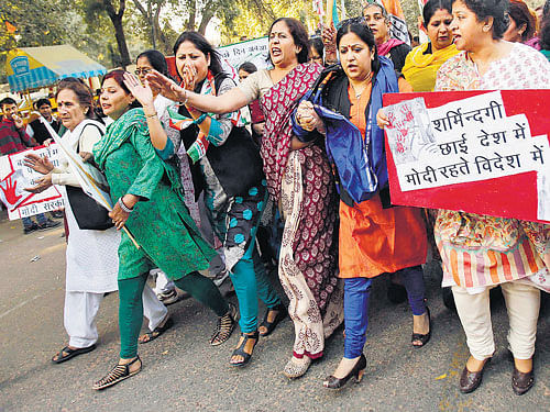 Members of All India Mahila Congress shout slogans and carry placards during a protest against the rape of a woman, in NewDelhi onMonday. REUTERS