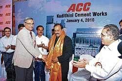 ACC MD Sumit Banerjee felicitating Tourism Minister Janardhana Reddy at the inauguration of ACC cement plant in Bellary on Monday.