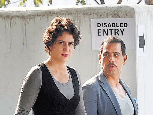 Priyanka Vadra along with husband Robert Vadra comes out after casting their votes in NewDelhi on Saturday. PTI