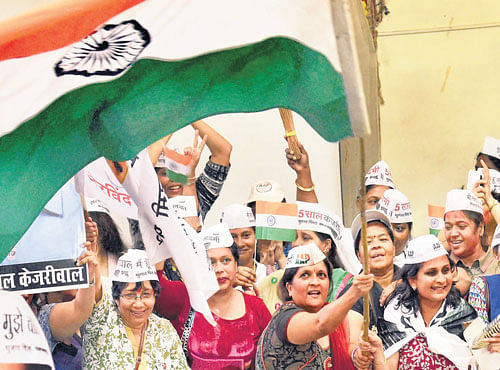 ALL CHEERS: AAP supporters celebrate the party's victory inMumbai on Tuesday. PTI