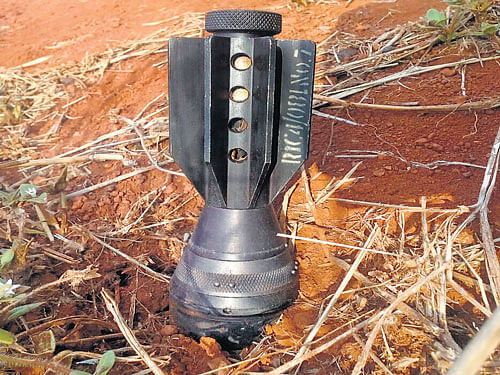 The live mortar bomb that was found in an open field in a  village near Belagavi on Sunday morning. DH photo