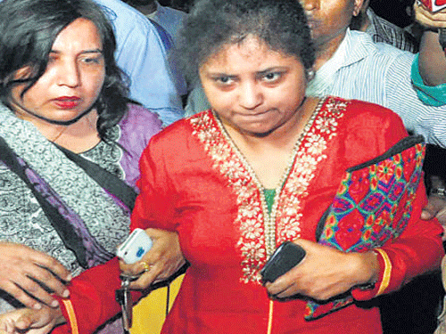 Lipika, wife of senior AAP leader Somnath Bharti, comes out of police headquarters in NewDelhi on Wednesday. PTI