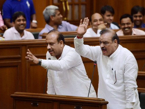 BJP MLAs Vijender Gupta and OP Sharma protest in the Delhi Assembly on the first day of its monsoon session in New Delhi. PTI photo