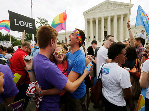 Gay rights supporters celebrate after the U.S. Supreme Court ruled that the U.S. Constitution provides same-sex couples the right to marry, outside the Supreme Court building in Washington, June 26, 2015. The court ruled 5-4 that the Constitution's guarantees of due process and equal protection under the law mean that states cannot ban same-sex marriages.  Reuters File Photo.