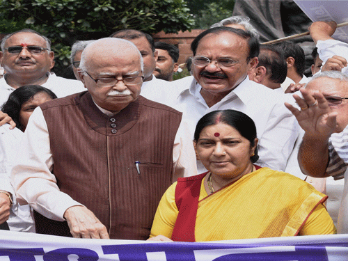 Senior BJP leader LK Advani, Sushma Swaraj, Venkaiah Naidu and other NDA MPs during their protest march from Vijay Chowk to Parliament House to 'Save Democracy' in New Delhi on Thursday. PTI Photo.