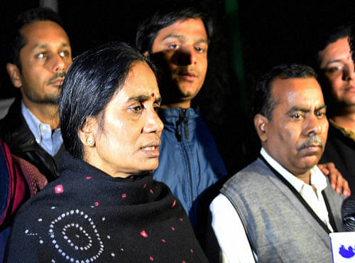 Jyoti Singh's parents outside Parliament on Tuesday. PTI