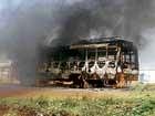 IN flames: A State road transport bus was set on fire during the protest at Hulkoti, Gadag taluk on Friday.  DH Photo