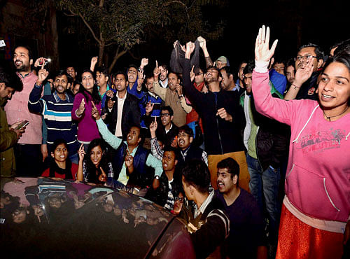 Students protest in front of Congress Vice president Rahul Gandhi's one of Conway car at the Jawaharlal Nehru University (JNU) in New Delhi on Saturday. Rahul Gandhi and many left leaders went to the campus to meet the students protesting for the release of Student Union president Kanhaiya Kumar. PTI Photo
