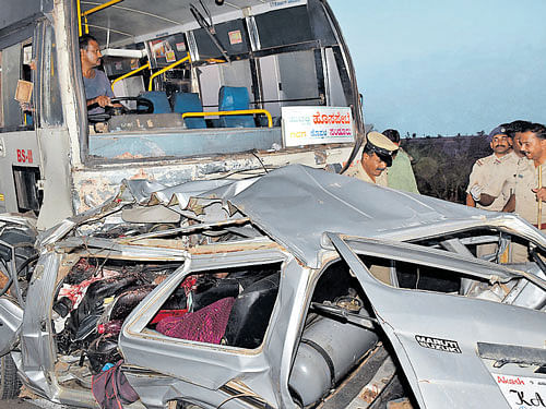 The mangled remains of a van which was hit by a KSRTC&#8200;bus killing 12 of a family near Harlapura Cross in Gadag district on Sunday. DH&#8200;Photo