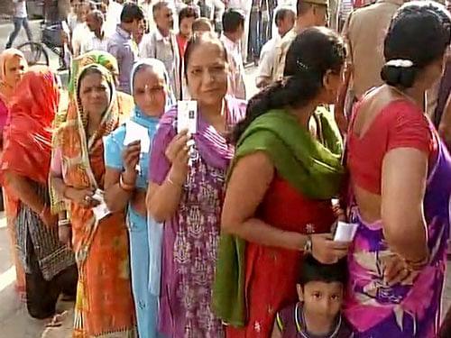 :Voting underway in 13wards across 3 Municipal Corporations of Delhi areas,people queue up to cast their vote. ANI